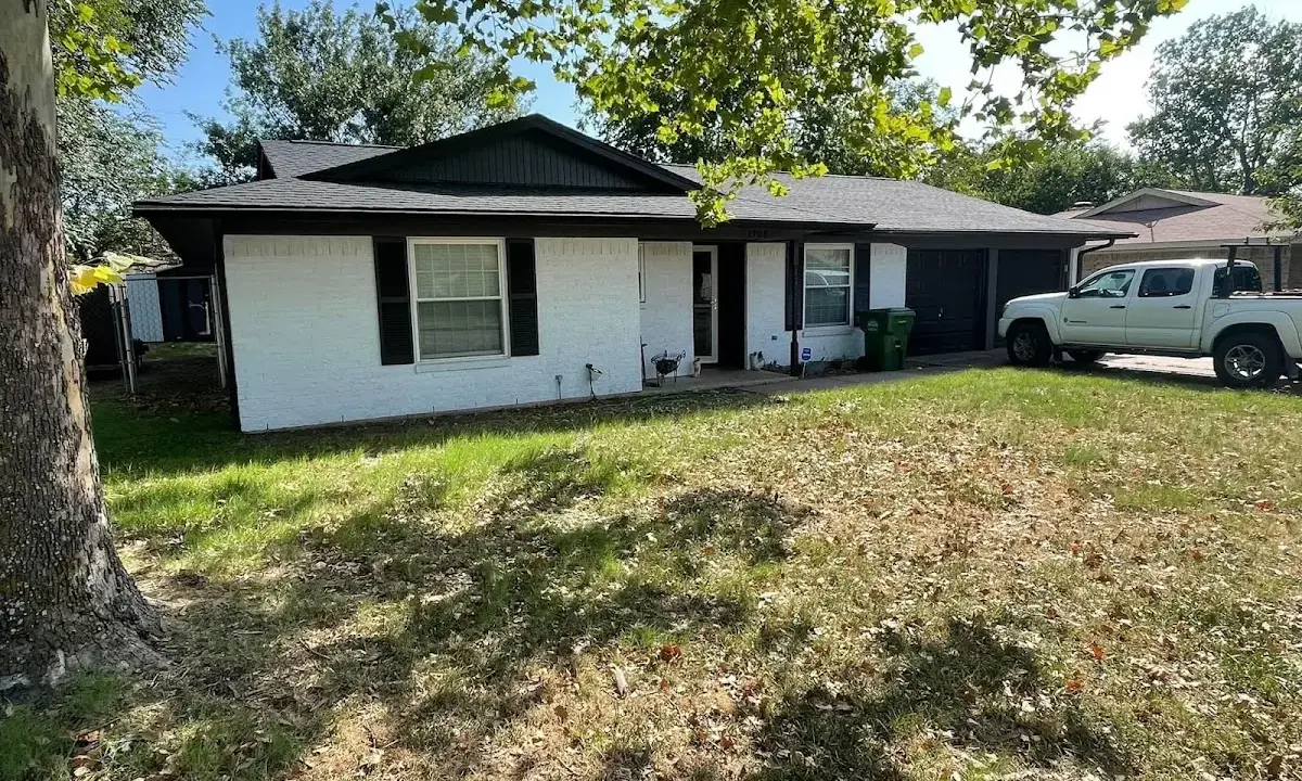Professional roofing crew working on a residential roof in Atascadero